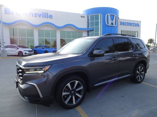 2023 Honda Pilot Elite in -Select- — front three-quarter view