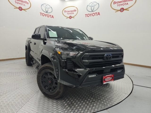 2025 Toyota Tacoma 4WD SR5 in Black — front three-quarter view