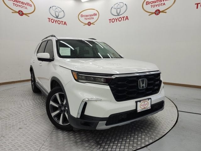 2023 Honda Pilot Elite in Platinum White Pearl — front three-quarter view