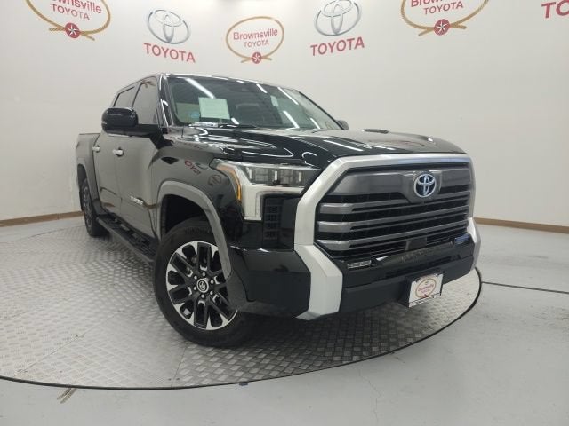 2024 Toyota Tundra 4WD Limited Hybrid in Midnight Black Metallic — front three-quarter view