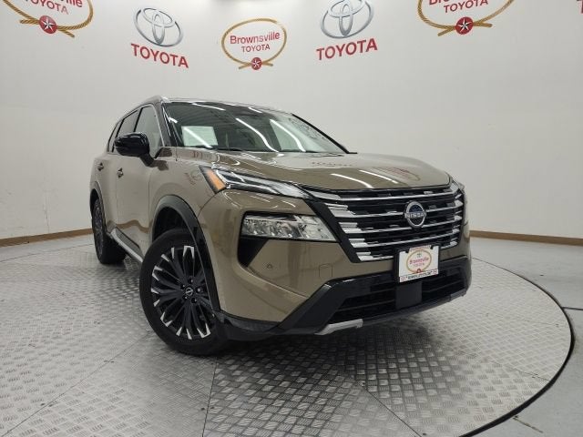 2024 Nissan Rogue Platinum in Baja Storm Metallic/Super Black — front three-quarter view